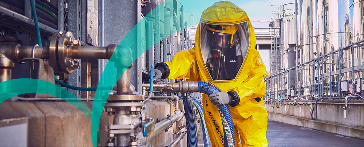 Image of worker wearing AlphaTec innovative chemical protective clothing in a chemical workplace in the outdoors