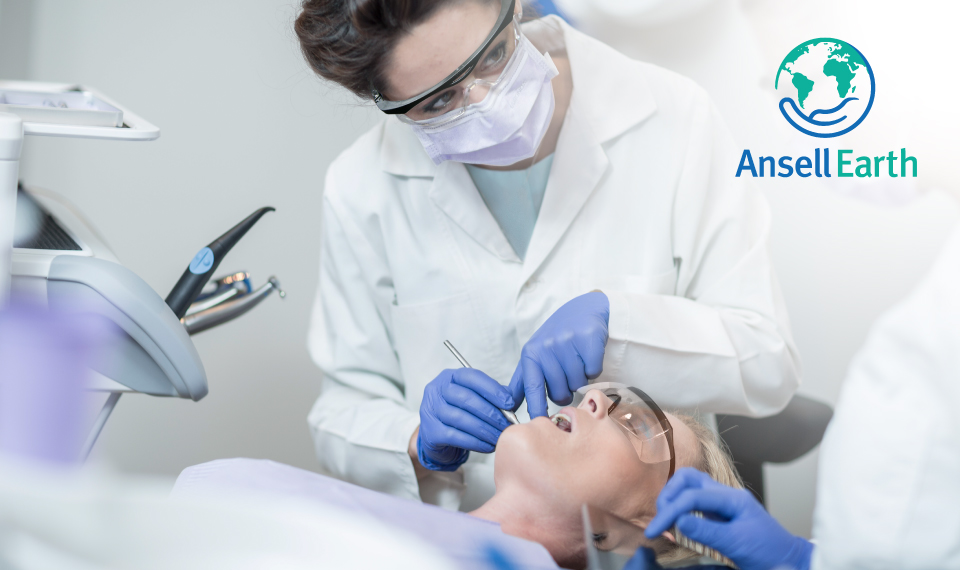 Image of dentist and the Ansell Earth icon in the top left hand corner