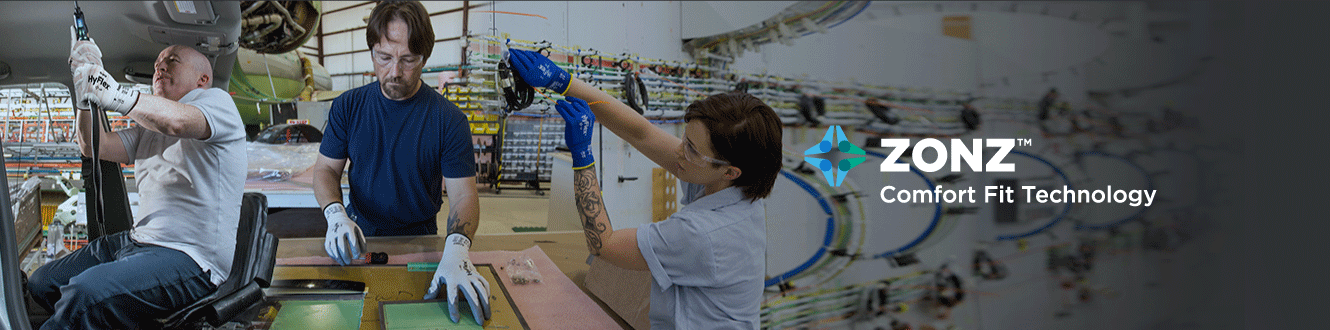 Workers wearing Ansell gloves with ZONZ™ Technology that improve hand movement, relieving the tension of repetitive motions