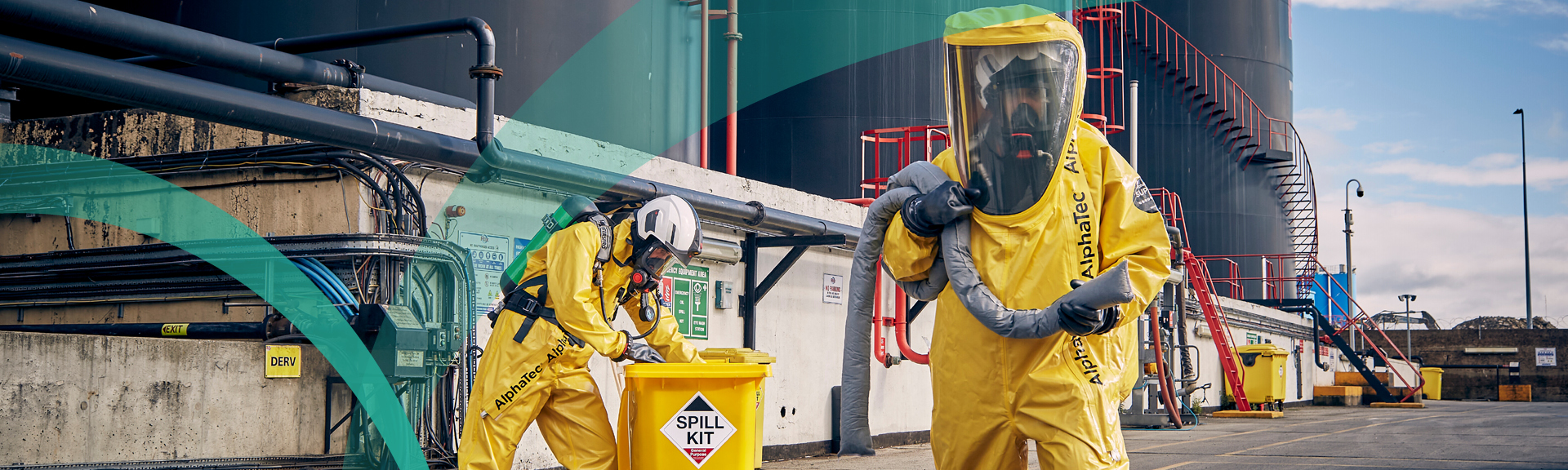 Industrial workers in yellow chemical protection suits