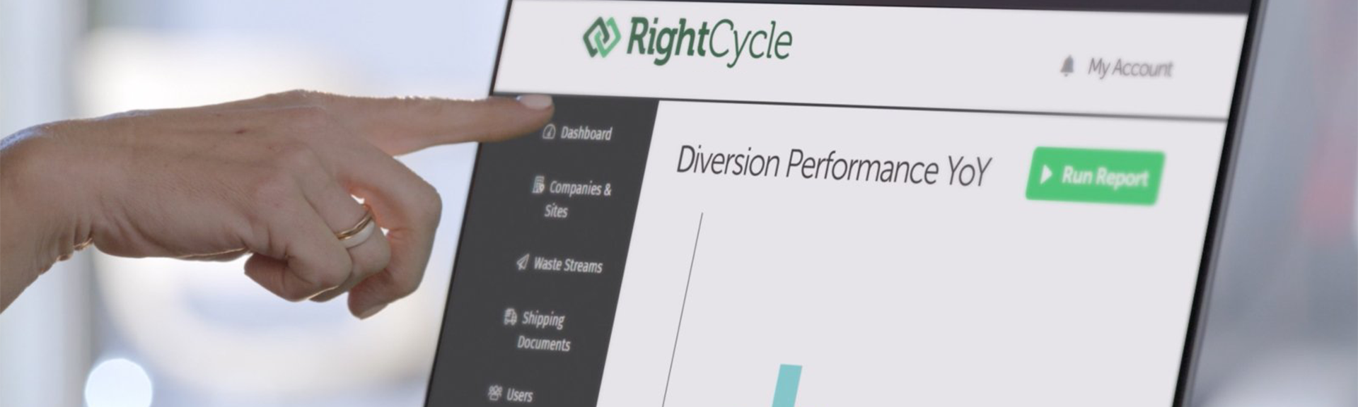  Alt text   A hand pointing to the RightCycle dashboard on a computer screen, highlighting the Diversion Performance YoY report 