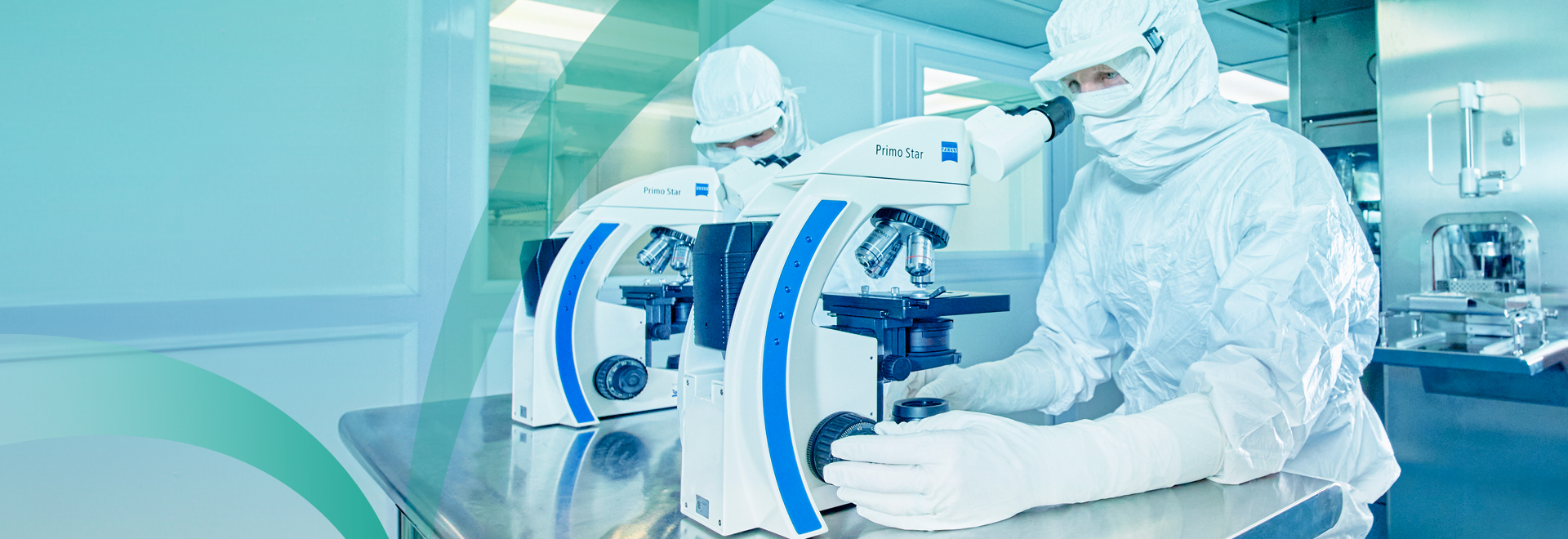 Cleanroom worker wearing cleanroom apparel in laboratory setting
