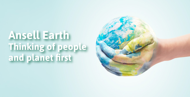 Image of an Ansell female employee posing against a background with recycling material and forest