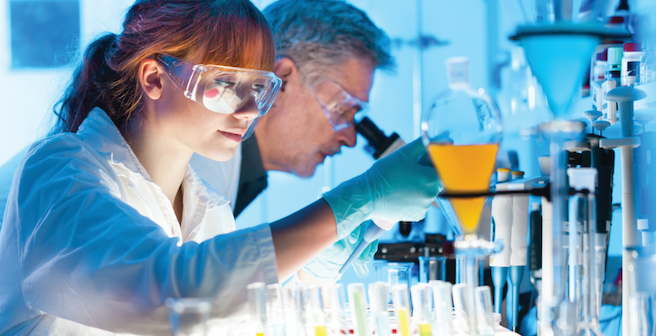 Technicians in Lab with Dramatic Lighting Stock Photo