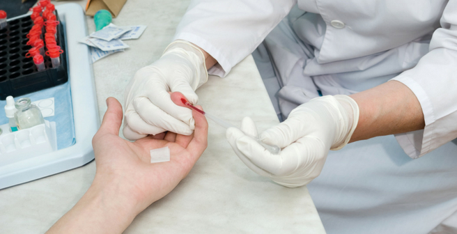 Primary Care Application - Finger Blood Test With Exam Glove