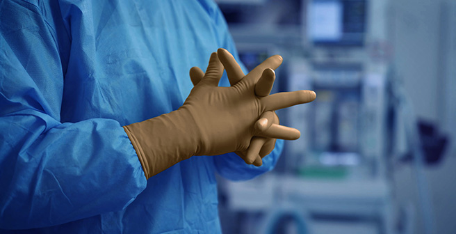 Healthcare professional wearing latex surgical gloves