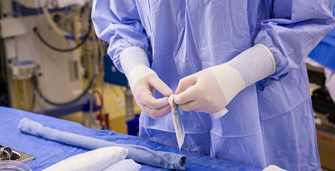 Healthcare professional wearing non-latex surgical gloves