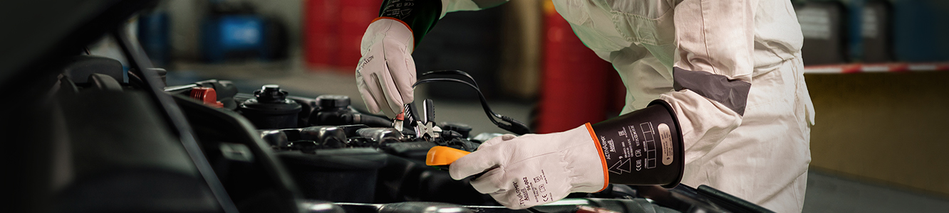 Rubber insulating gloves are the preferred choice to protect against hazardous electrical sparks as they are designed to protect against electrical hazards.